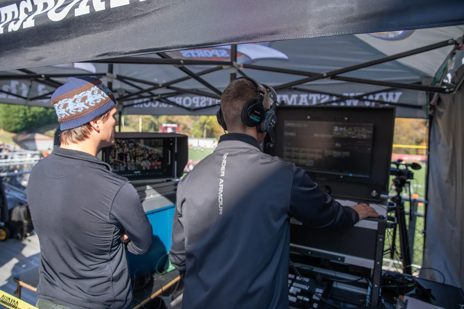The production crew coordinating a multi-camera broadcast.