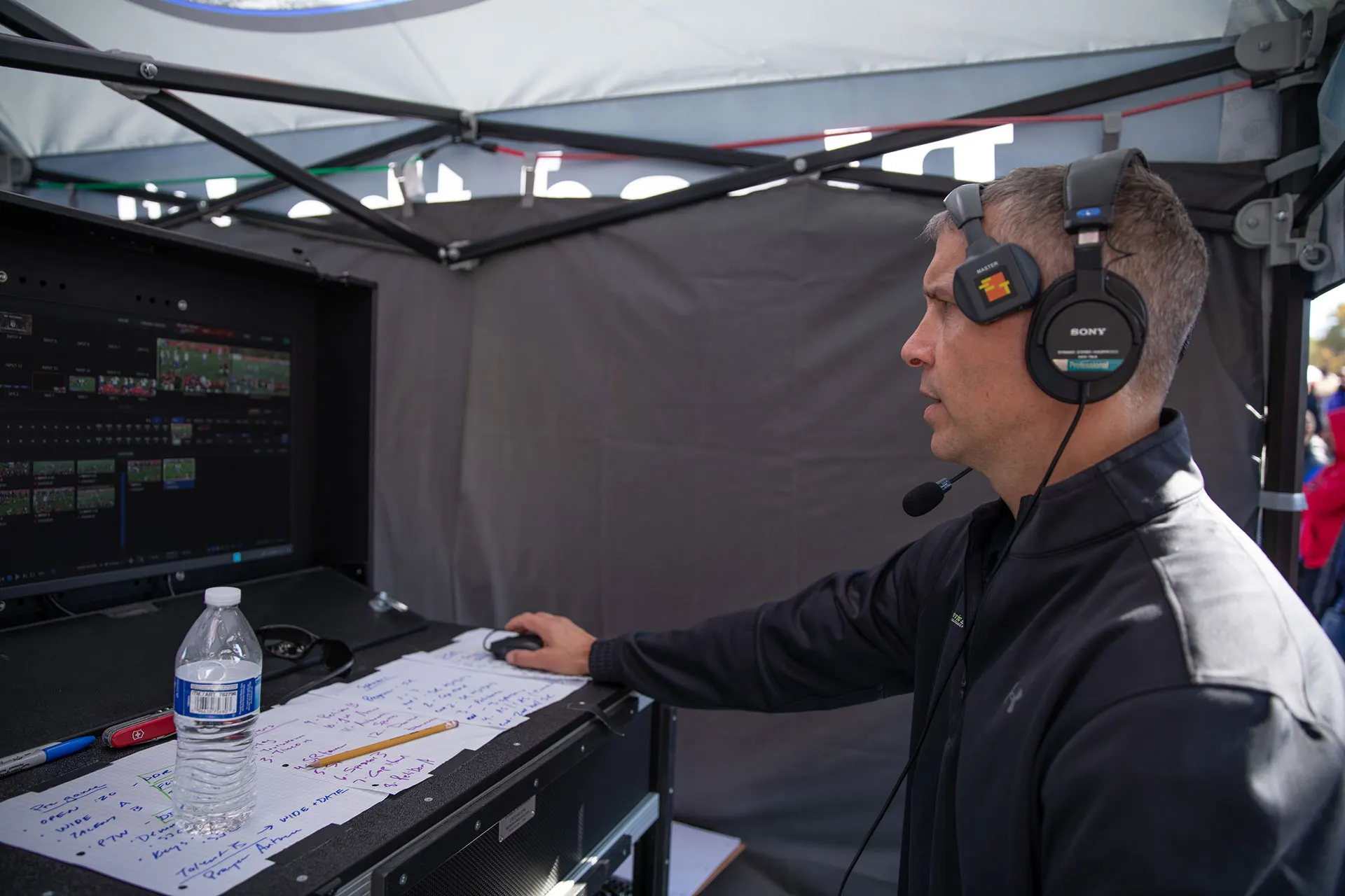 A sideline camera operator following action along the touchline.