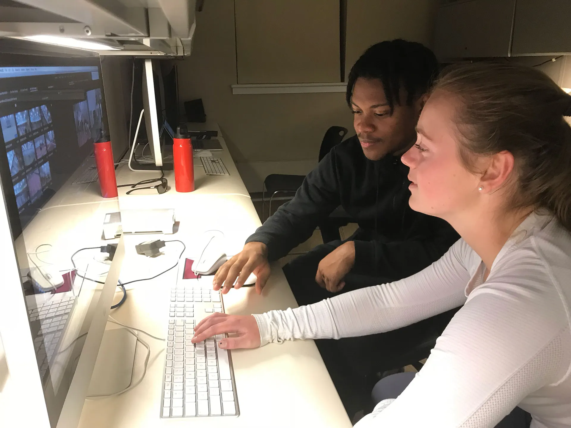 A student broadcast crew running a game from their control position.